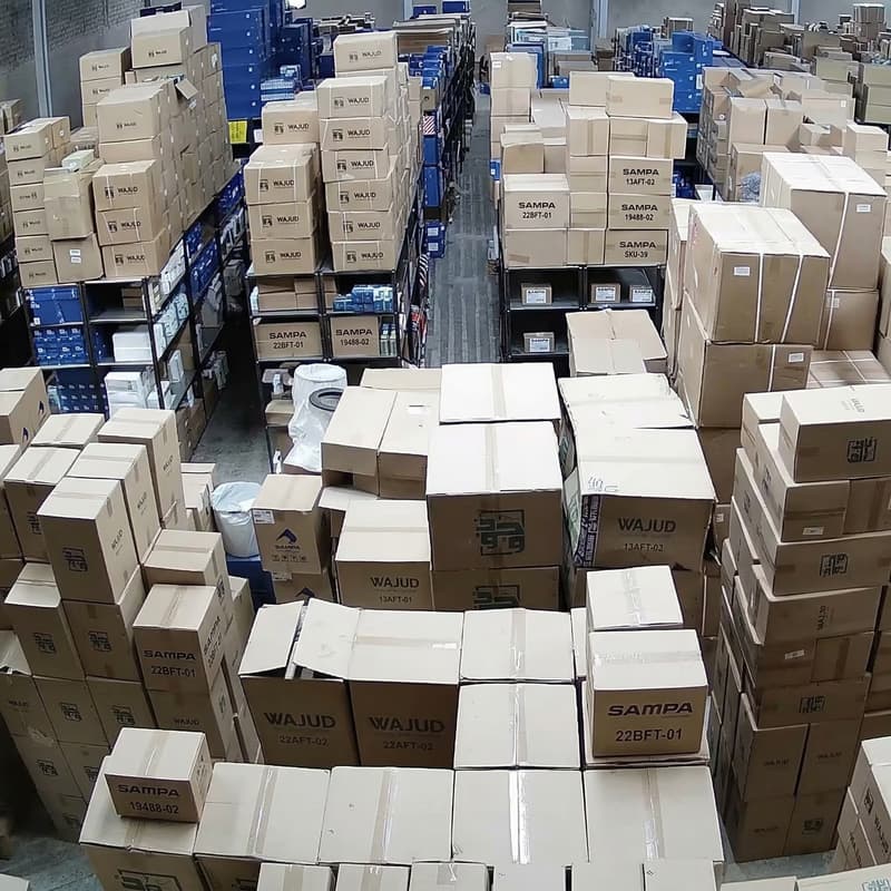 Tall shelves stocked with boxed truck parts