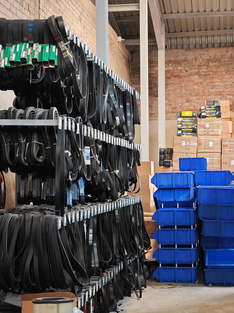 Drive belts and blue storage bins